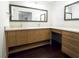 Bathroom featuring double vanities, generous countertop space, and ample storage in a stylish wood finish at 5252 Biffle Rd, Stone Mountain, GA 30088