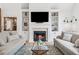 Warm living room featuring a fireplace, built-in shelving, and comfortable seating at 675 Old Lathemtown Rd, Canton, GA 30115