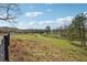 Pastoral land with perimeter fencing and mature trees at 675 Old Lathemtown Rd, Canton, GA 30115