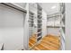 Well-organized walk-in closet featuring built-in shelves, drawers, and ample storage space at 675 Old Lathemtown Rd, Canton, GA 30115