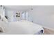 Bright bedroom with wood-look floors, neutral walls, a comfortable bed, and ensuite bathroom at 6851 Roswell Rd # M12, Sandy Springs, GA 30328