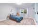 Bedroom with a twin bed, neutral paint and hardwood floors at 6851 Roswell Rd # M12, Sandy Springs, GA 30328