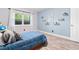 Bedroom with a twin bed, neutral paint and hardwood floors at 6851 Roswell Rd # M12, Sandy Springs, GA 30328