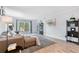 Bright living room with neutral paint, gray wood flooring, and ample natural light at 6851 Roswell Rd # M12, Sandy Springs, GA 30328