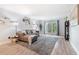 Cozy living room with neutral color palette, plush rug, and a comfortable gray sofa at 6851 Roswell Rd # M12, Sandy Springs, GA 30328