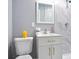 Bathroom with a modern vanity, toilet and a shower with white and gray tiles at 10664 Sandpiper Road Rd, Jonesboro, GA 30238