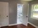 Bedroom with a connecting bathroom, hardwood floors, and a bright window at 10664 Sandpiper Road Rd, Jonesboro, GA 30238