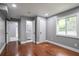 Finished basement bedroom with hardwood floors, neutral paint and attached bath at 10664 Sandpiper Road Rd, Jonesboro, GA 30238