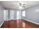 Bedroom featuring hardwood floors, three doors and a bright window at 10664 Sandpiper Road Rd, Jonesboro, GA 30238
