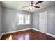 Bedroom with hardwood floors, ceiling fan and two bright windows at 10664 Sandpiper Road Rd, Jonesboro, GA 30238