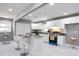 Well-lit kitchen with white cabinetry, stainless steel appliances, and granite countertops at 10664 Sandpiper Road Rd, Jonesboro, GA 30238