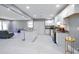 Open-concept kitchen and living area with modern appliances, granite countertops, and sleek design at 10664 Sandpiper Road Rd, Jonesboro, GA 30238
