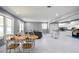 Open-concept living and dining area boasts sleek marble floors, gray walls and a wet bar at 10664 Sandpiper Road Rd, Jonesboro, GA 30238