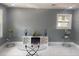 Bright living room features marble floors, gray walls and a modern entertainment center at 10664 Sandpiper Road Rd, Jonesboro, GA 30238