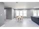 Open-concept living and dining area boasts sleek marble floors and grey walls at 10664 Sandpiper Road Rd, Jonesboro, GA 30238