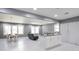 Bright, open living space with large windows, modern lighting, and a kitchen island with granite countertops at 10664 Sandpiper Road Rd, Jonesboro, GA 30238