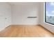 Well lit bedroom with hardwood flooring and large window with a scenic view at 3445 Stratford Ne Rd # 2403, Atlanta, GA 30326
