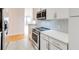 Modern kitchen featuring stainless steel appliances, white cabinetry, and hardwood floors at 3445 Stratford Ne Rd # 2403, Atlanta, GA 30326