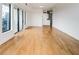 Bright living room featuring hardwood floors and a sliding glass door leading to a balcony at 3445 Stratford Ne Rd # 2403, Atlanta, GA 30326