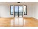 Spacious living room showcasing hardwood floors and a large window with city views at 3445 Stratford Ne Rd # 2403, Atlanta, GA 30326