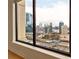 Close-up of city view with skyscrapers from an interior window at 3445 Stratford Ne Rd # 2403, Atlanta, GA 30326