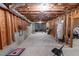 Unfinished basement with exposed wood beams and a concrete floor at 1030 Silver Thorne Dr, Loganville, GA 30052