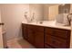 Bathroom featuring a dark wood vanity with a white countertop and neutral wall paint at 1030 Silver Thorne Dr, Loganville, GA 30052