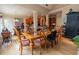 Inviting dining room with hardwood floors, bright lighting, and access to both the kitchen and living areas at 1030 Silver Thorne Dr, Loganville, GA 30052