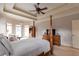 Serene main bedroom with a trey ceiling, large windows, and comfortable sitting area, creating a relaxing retreat at 1030 Silver Thorne Dr, Loganville, GA 30052