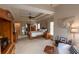 Expansive main bedroom featuring hardwood floors, multiple dressers and a sitting area at 1030 Silver Thorne Dr, Loganville, GA 30052