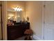 Stylish vanity area with granite countertop, dark wood cabinetry, and ample lighting at 1030 Silver Thorne Dr, Loganville, GA 30052