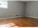 This bedroom offers natural light, wood floors, and neutral paint at 10836 Mallard Dr, Jonesboro, GA 30238