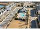 Aerial view of a community pool and clubhouse, with manicured landscaping and nearby residences at 127 Harlow Cir, Roswell, GA 30076