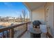 Cozy balcony featuring comfortable chairs and a small table for outdoor enjoyment at 127 Harlow Cir, Roswell, GA 30076