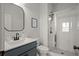 Bright bathroom featuring a glass-enclosed shower and a modern vanity with sleek fixtures at 127 Harlow Cir, Roswell, GA 30076