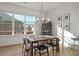 Cozy dining area with modern chandelier, wooden table, and large windows at 127 Harlow Cir, Roswell, GA 30076