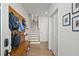 Inviting entryway with wood bench, coat hooks, and stylish decor at 127 Harlow Cir, Roswell, GA 30076