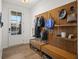 Inviting entryway with wood bench, coat hooks, and stylish decor at 127 Harlow Cir, Roswell, GA 30076