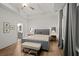 Spacious main bedroom with elegant decor, tray ceiling, and calming ambiance at 127 Harlow Cir, Roswell, GA 30076