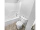 Bathroom featuring a shower and bathtub combo and tiled flooring at 2341 Wellington Cir, Lithonia, GA 30058