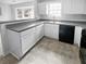 Well-lit kitchen featuring ample countertop space, light cabinets, and a clean design at 2341 Wellington Cir, Lithonia, GA 30058