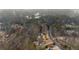 Overhead view of the estate showcasing wooded surroundings at 3591 Lochwolde Ln, Snellville, GA 30039