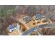 Wide aerial shot of the house highlighting surrounding landscaping and tree coverage at 3591 Lochwolde Ln, Snellville, GA 30039