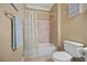 Bathroom featuring a white shower/bathtub combination and a matching toilet, along with decorative signage at 3591 Lochwolde Ln, Snellville, GA 30039