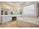 Relaxing bathroom with soaking tub, white cabinets, and a luxurious vanity area with ample space at 3591 Lochwolde Ln, Snellville, GA 30039