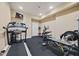 Exercise room with modern treadmill and various weight machines for a complete workout at 3591 Lochwolde Ln, Snellville, GA 30039