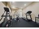 Home gym featuring an elliptical machine, treadmill, and weightlifting equipment at 3591 Lochwolde Ln, Snellville, GA 30039