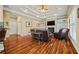 Bright living room boasts hardwood floors, built-in shelving, and a fireplace at 3591 Lochwolde Ln, Snellville, GA 30039