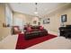 Cozy basement features a black piano, leather sofa, and bright carpet at 3591 Lochwolde Ln, Snellville, GA 30039