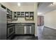 Kitchen area featuring stainless steel appliances and gray cabinets open to a spacious living room at 800 Peachtree Ne St # 8508, Atlanta, GA 30308